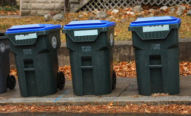 trashcan on city sidewalk, litter scattered around, environmental issue, waste management concept