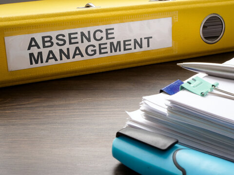 Folder about absence management and papers.