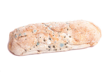 Spoiled loaf of white bread with mold isolated on white background