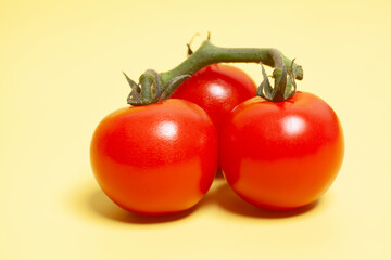 Mini Tomatoes On Yellow Background