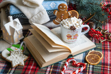 Obraz na płótnie Canvas A cup of hot, aromatic cocoa with marshmallows, a calendar for 2024, a New Year's mood.