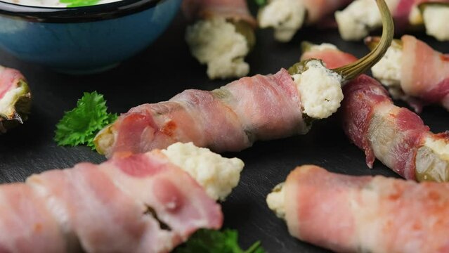 Homemade Bacon Wrapped Jalapeno Poppers with Cream Cheese. Rotating video