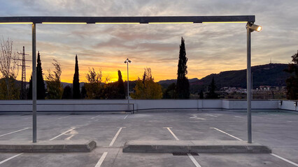 empty parking lot with the sky in the background on a spectacular sunset