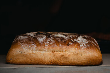 loaf of bread on wooden table