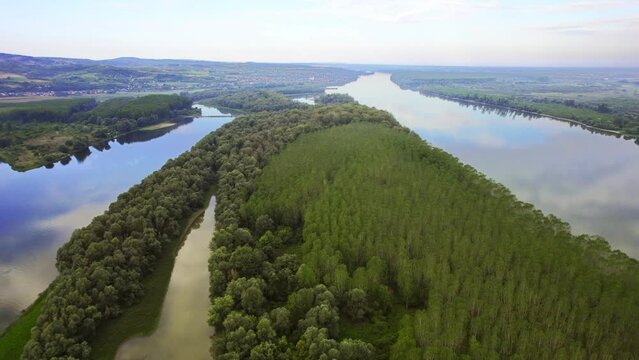 Aerial footage of woods on river island of Danube and surrounding landscape