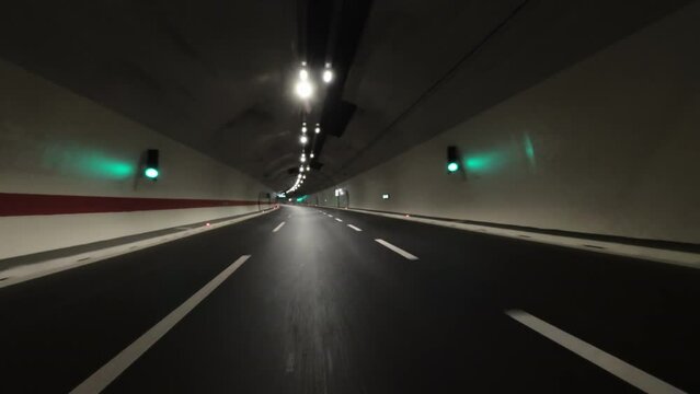 POV fast car driving in tunnel on the highway, 4k
