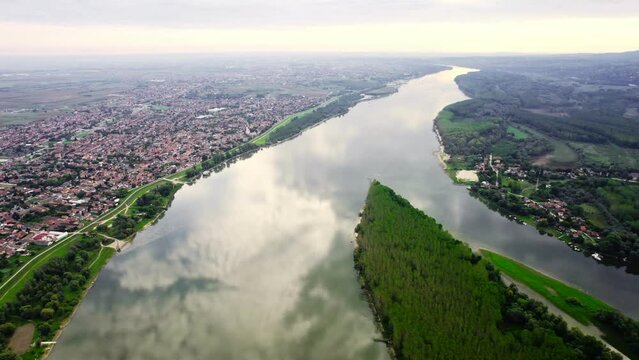 Mirror-like reflection of a sky on surface of a river Danube near town Beocin, Serbia