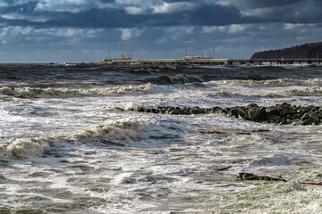 The Black Sea during a storm. An epic seascape. Beautiful sea waves during a storm. Big waves crash on the shore under a cloudy sky. View of the stormy seascape. Large sea waves during a storm.