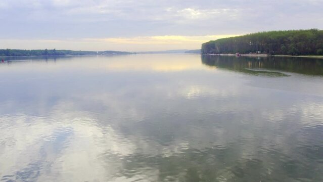 Drone flight above river Danube in a sunset near Beocin, Serbia