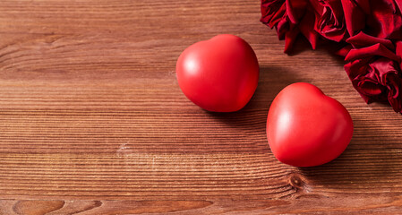 Valentines day frame with heart and red roses on a wooden background. Valentines day banner with copy space