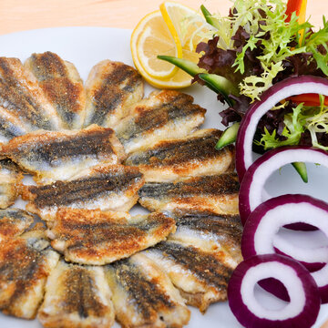 Delicious and beautiful fried hamsi fish and salads