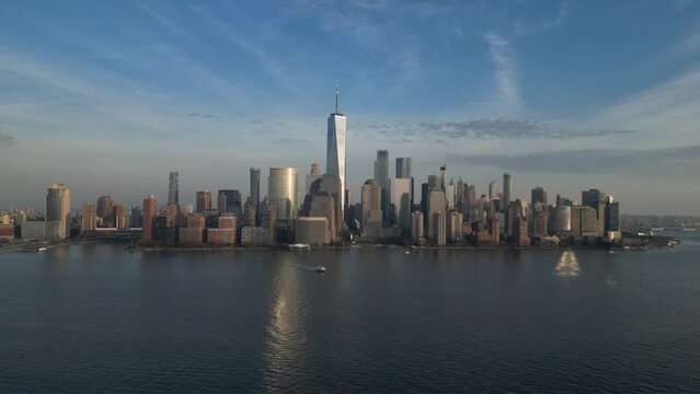 still shot of nyc skyline (downtown manhattan, new york city) view from jersey city waterfront (hudson river harbor) aerial drone 4k footage (still, water flowing, moving, pan) rising (skyscrapers)