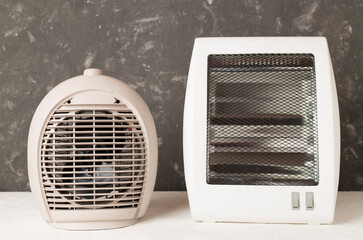 Portable electric heaters on table