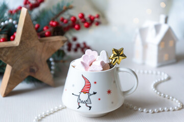 A cup of hot, aromatic cocoa with marshmallows, a calendar for 2024, a New Year's mood.