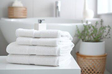 Obraz na płótnie Canvas White Modern blurred bathroom interior with towels. Home design
