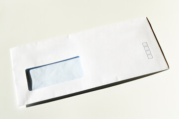 White paper mail rectangle envelope with address window on a white background