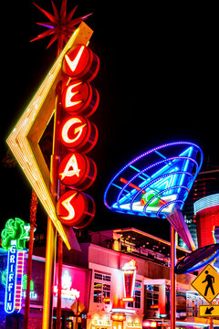 A martini glass and Vegas sign on Fremont Street at night