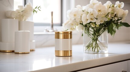  a vase filled with white flowers sitting on top of a counter next to a vase filled with white flowers and a vase filled with white and gold vase filled with white flowers.