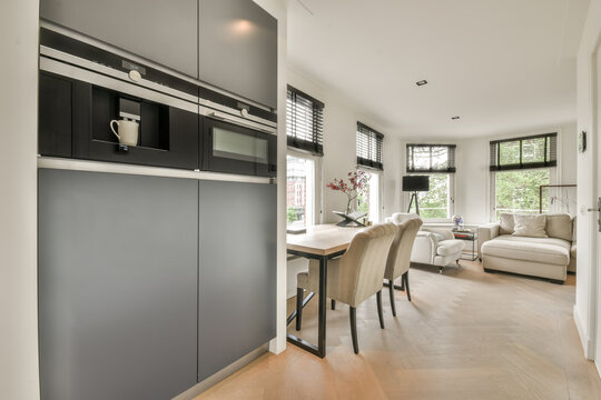 Fitted appliances by desk and furniture