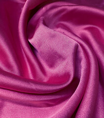 Luxurious of smooth pink silk or satin fabric texture with smooth cotton, pink luxury cloth background with silk texture, pink background with folded fabric stains perfect for design.