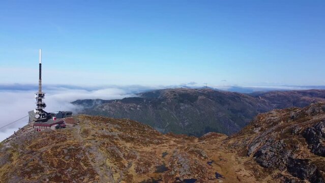 Overview of Ulriken and other Mountains in the Clouds - Bergen, Norway 2.7K Aerial Footage