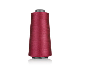 spool of industrial thread red, texture of thread on a white background