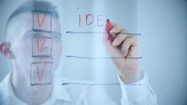 Businessman Writing Checklist On Transparent Screen. Business And Social Media Concept. Close Up