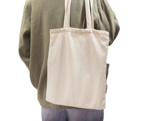 Natural eco tote bag mockup on shoulder. Woman back with shopper isolated on white