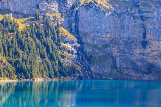 View of Oeschinen lake (Oeschinensee) and Swiss Alps near Kandersteg in Bernese Oberland, Switzerland