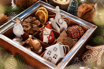 Christmas decors in wooden shadow box lying on the table