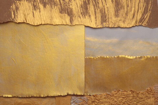 Gold, bronze and beige paper collage paper frame painting wall. Abstract glow texture copy space relief background.