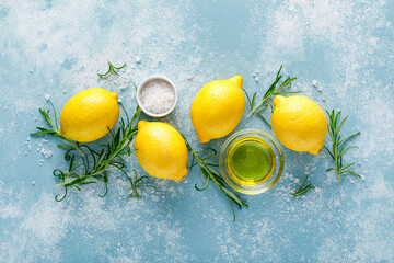 Lemon, rosemary, garlic, salt and olive oil. Ingredients for mediterranean cuisine cooking. Top view