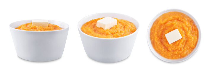 Cooked sweet potato puree in a bowl on a white isolated background