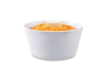 Cooked sweet potato puree in a bowl on a white isolated background
