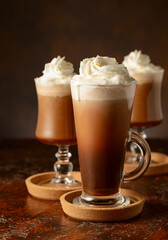 Creamy milk chocolate drinks with whipped cream.