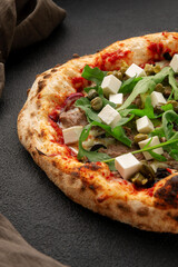Oven pizza with arugula, stracciatella, mozzarella cheese