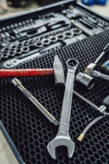 Fototapeta premium Tools and toolbox on the showcase. Many wrench and nuts in toolkit sets