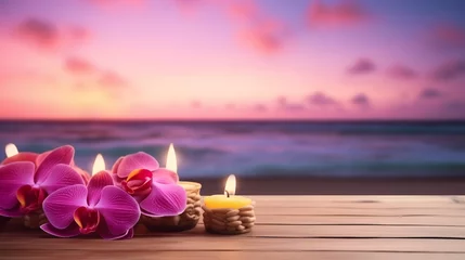 Gardinen Wooden tabletop for product display with tropical pink orchids flowers and burning candles. Morning sky and sea at the background behind. Meditation concept. Copy space © Neira