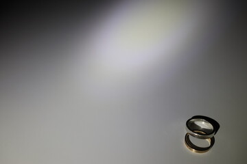 Wedding ring in gold and a silver ring with the text Love 
