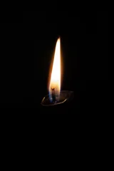 Fototapeten burning candle in the dark © yvet