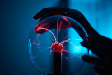 plasma ball. Hands holding plasma light ball. Plasma ball light ray science. Finger touching Plasma...