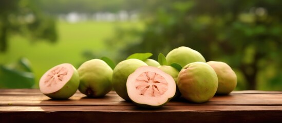 portrait of fresh guava pieces and lots of vitamins on a wooden table