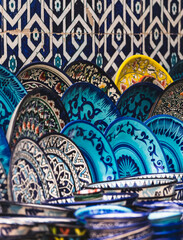 Old ceramic plates with traditional oriental painting and patterns in Central Asia, ornaments on kitchen plates