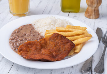 Milanese beef, rice, beans and french fries. Typical brazilian executive dish