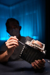 Cleaning a processor fan with a brush