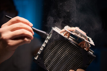 Cleaning a processor fan with a brush