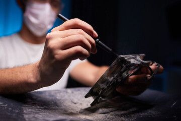 Cleaning a processor fan with a brush
