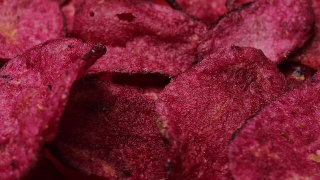 pink sweet potato chips, rotation in circle. Fried pink chips from the barracks (fast food), Turning. selective focus. vegetable chips

