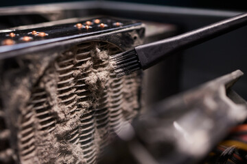 Close-up of a PC cooling system, a dirty radiator from a computer