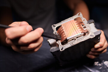 Cleaning a processor fan with a brush